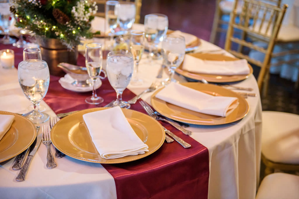 Christmas Inspired Wedding Reception Decor, Round Table with White Tablecloth, Red Table Runner, Gold Chargers