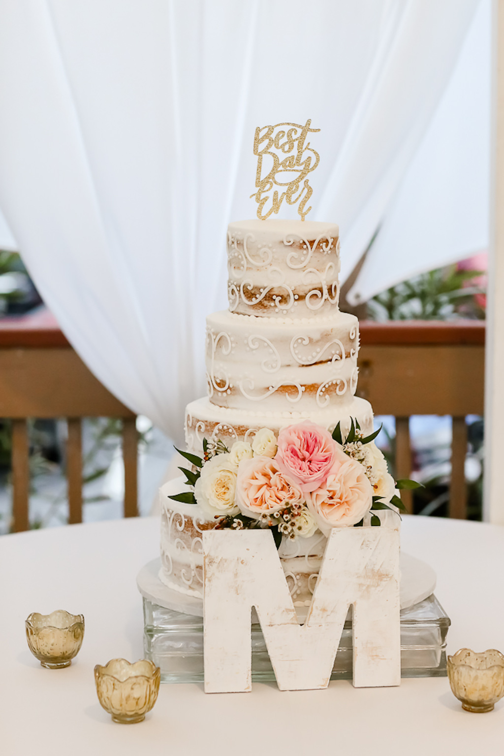 Four Tier Semi-Naked Unfrosted White Wedding Cake with Blush Pink and Ivory Floral Arrangement, Best Day Ever Gold Glitter Cake Topper, Wooden Monogram | Photographer Lifelong Photography Studios