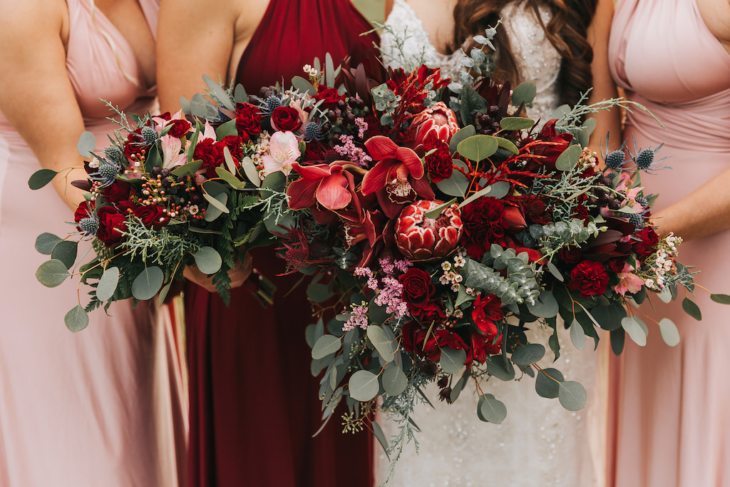 Bold Red and Pink Floral Wedding Bouquets with Greenery | Christmas Inspired Wedding Decor