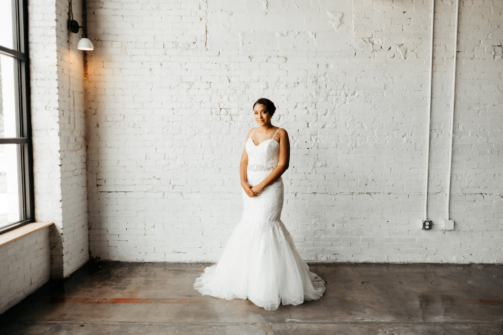 Tampa Bay Bride Wedding Portrait in Spaghetti Strap Lace Sweetheart Neckline, Fitted Mermaid Wedding Dress with Tulle Skirt and Rhinestone Crystal Belt | Lakeland Industrial Modern Wedding Venue and Event Space Haus 820
