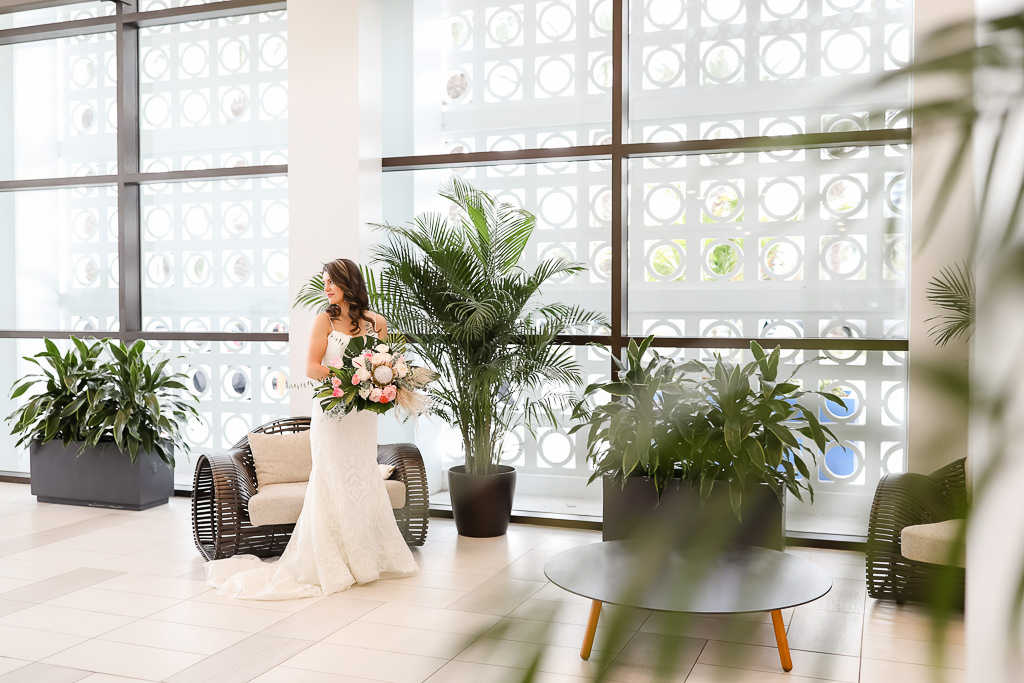 White and Pink Flower Bouquet with Green Palms, Florida Bridal Portrait, Bride in Spaghetti Strap Sweetheart Neckline White Fitted Hayley Paige Wedding Dress, | Photographer Lifelong Photography Studios | Hilton Clearwater Beach