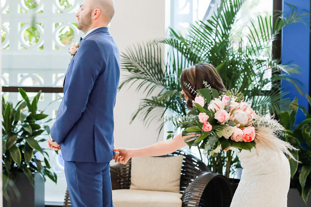 White and Pink Floral Wedding Bouquet with Green Palms, Bride and Groom First Look Wedding Portrait, Groom in Blue Suit | Photographer Lifelong Photography Studios