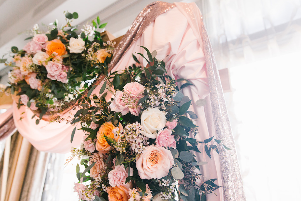 Indoor Ballroom Wedding Ceremony Decor, Wooden Arch with Blush Pink and Glitter Draping, Colorful Flower Bouquets, Peach, Pink, Ivory, Orange and Greenery Florals