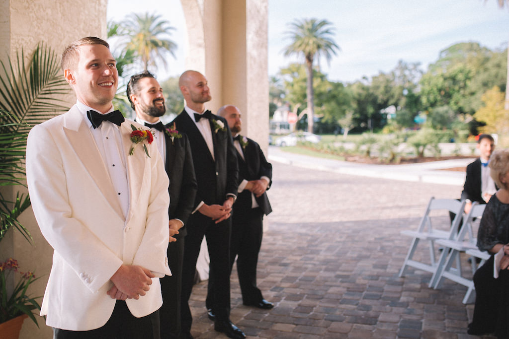Clearwater Groom in White Velvet Tuxedo Jacket During Outside Ceremony at Tampa Bay Wedding Boutique Hotel Wedding Venue Fenway Hotel