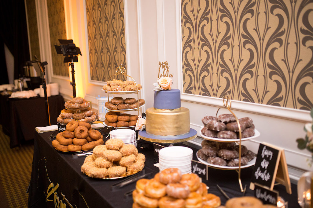 Classic, Elegant Wedding Reception Decor Dessert Table with Donuts and Two Tier Purple and Gold Wedding Cake