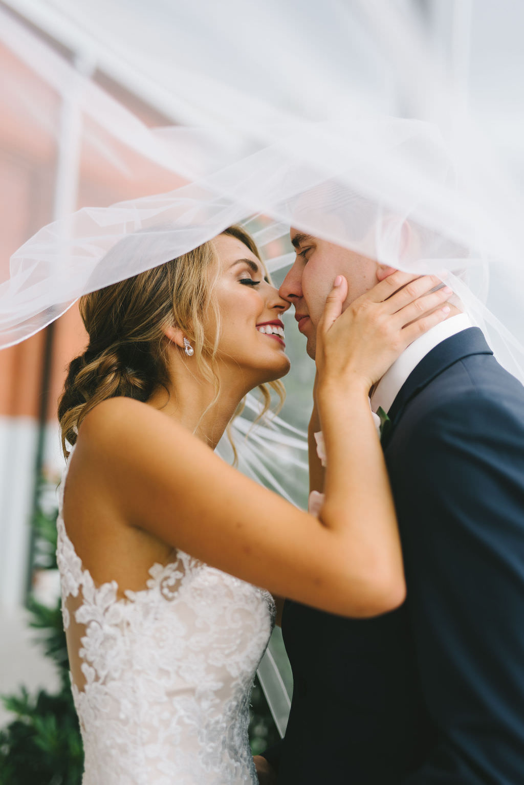 Intimate Bride and Groom Wedding Portrait with Veil Blowing in Wind | Tampa Wedding Photographer Kera Photography