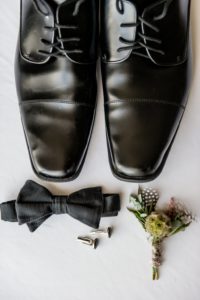 Groom’s Classic Black Accessories Wedding Detail Portrait, Black Formal Shoes, Black Bowtie, Black Cufflinks, Multi-colored and Textural Floral Boutonniere with Scabiosa, Feathers and Pampas Grass | Tampa Bay Wedding Photographer Andi Diamond Photography | Tampa Bay Wedding Planner UNIQUE Weddings + Events