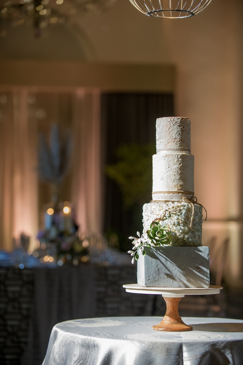 Four Tier Neutral Tone Cake, Textured Surface, Natural Elements with Green and White Succulent, Burlap and Lace Ribbon, Wooden Cake Stand | Tampa Bay Wedding Cake Decorator The Artistic Whisk | Tampa Bay Wedding Photographer Andi Diamond Photography