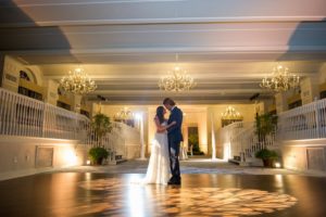 Bride and Groom First Dance During Intimate Wedding Portrait | Bride in Long Flowy White Dress, Standing in Ballroom under Chandeliers and Mood Lighting | Tampa Bay Wedding Photographer Andi Diamond Photography | St. Pete Beach Wedding Venue The Don Cesar | Wedding Dress Shop Truly Forever Bridal