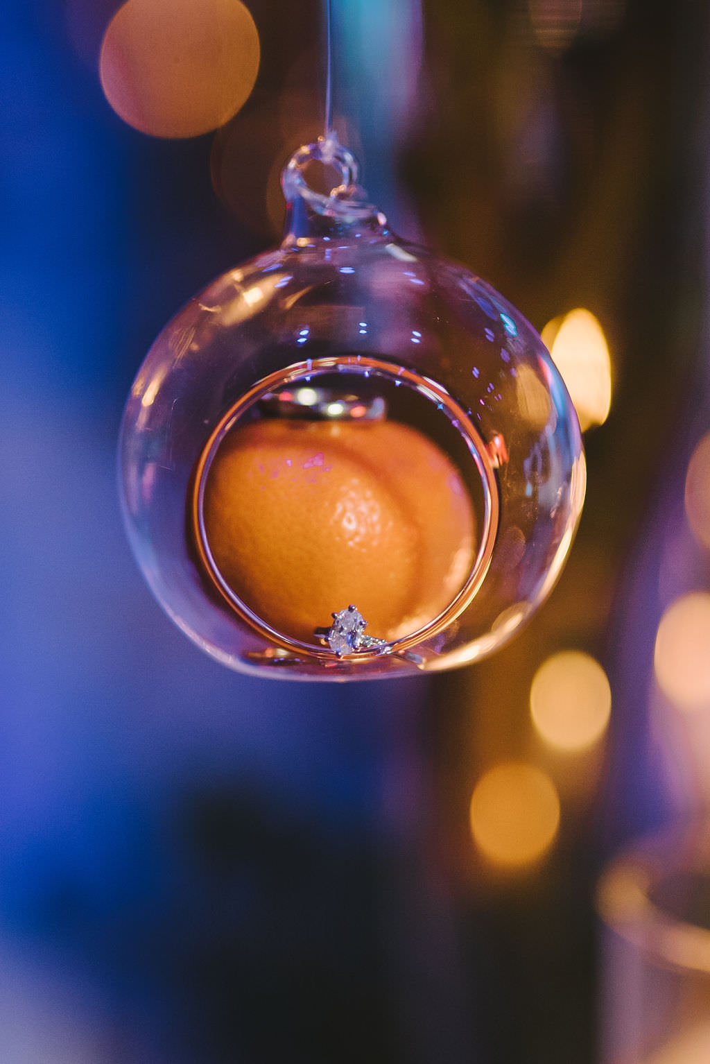 Orange Fruit in Hanging Glass Cylinder with Bride Oval Diamond Engagement RingTampa Bay Wedding Photographer Kera Photography