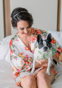 Tampa Bay Bride Getting Ready Wedding Portrait in Floral Robe Holding Dog | FairyTail Pet Care