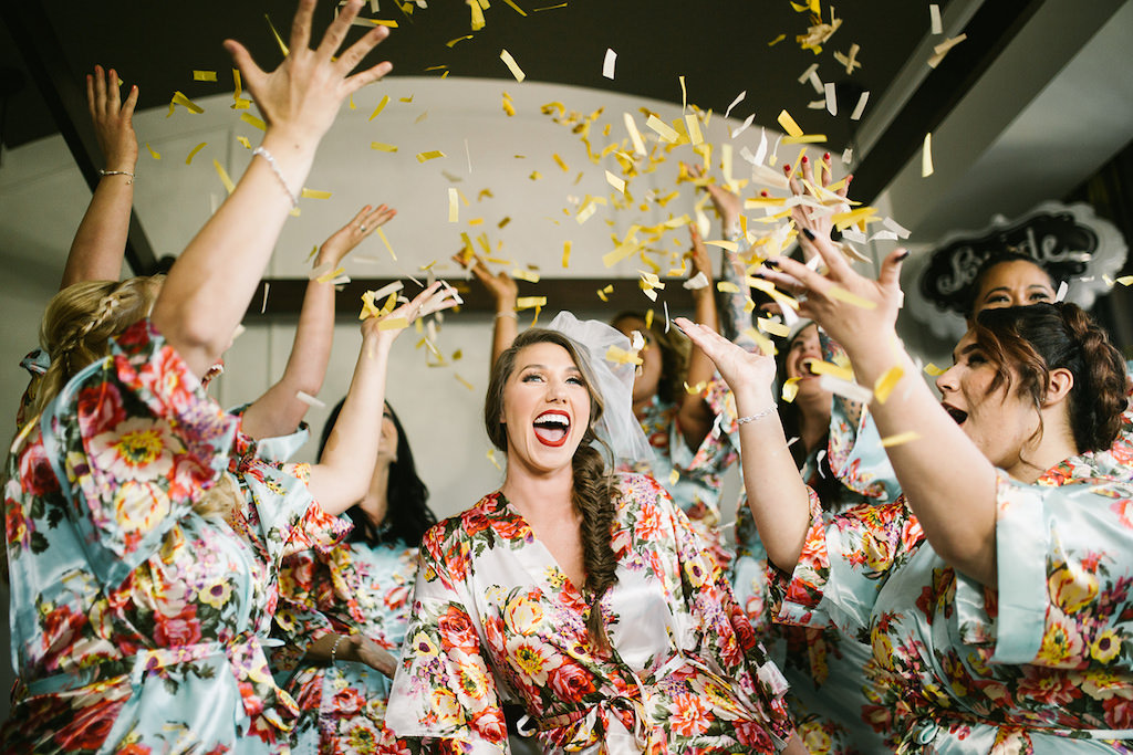 Bride and Bridesmaids Getting Ready Wedding Portrait with Floral Robes and Confetti Toss
