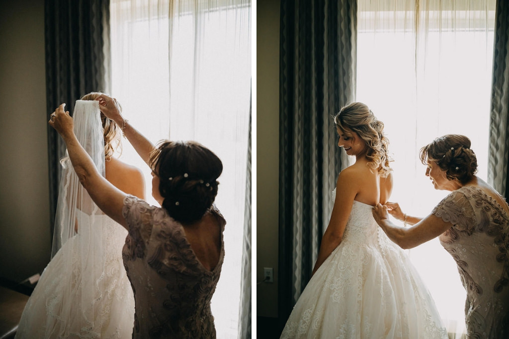 Bride and Mother of the Bride Getting Ready Photo, Back of Strapless David's Bridal Wedding Dress with Lace Overlay and Veil, Mother of Bride with Side Updo with Rhinestone Hair Accessory | Tampa Bay Wedding Courtyard by Marriott St. Petersburg Downtown