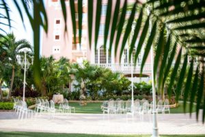 Chic Neutral Tone Modern Outdoor Ceremony with Ghost Acrylic Chairs | | St. Pete Beach Resort Wedding Venue The Don Cesar | Tampa Bay Wedding Photographer Andi Diamond Photography| Tampa Wedding Rentals A Chair Affair | Tampa Bay Wedding Planner UNIQUE Weddings + Events