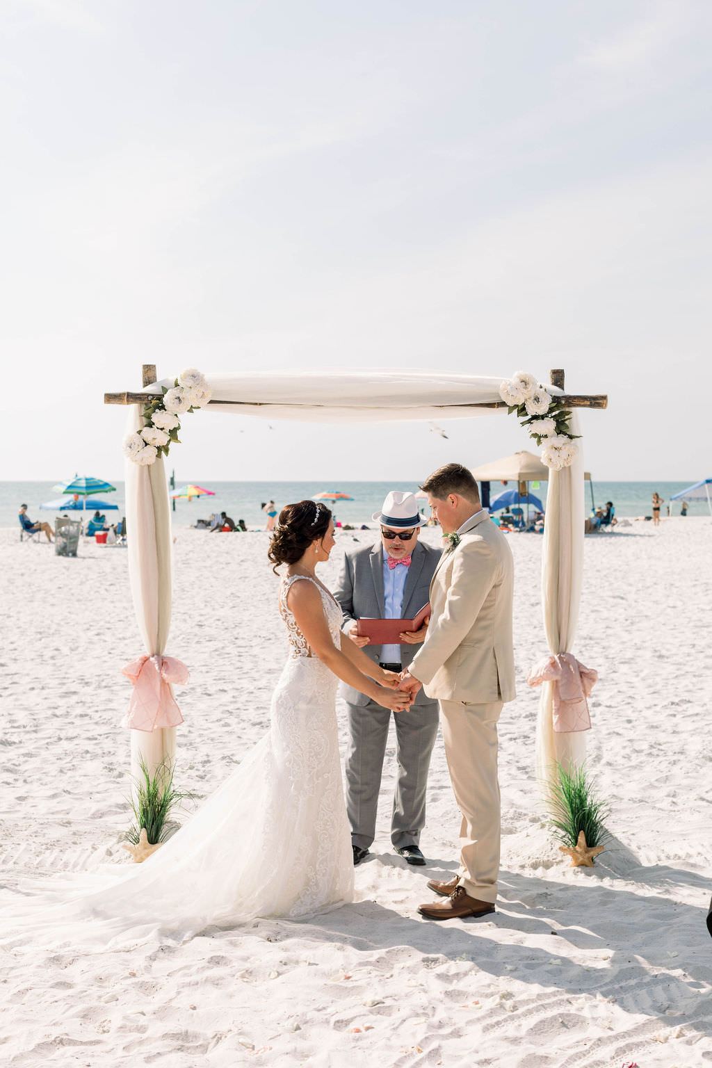 Florida Bride and Groom Exchanging Vows During Clearwater Beach Wedding Ceremony | Planner Gulf Beach Weddings