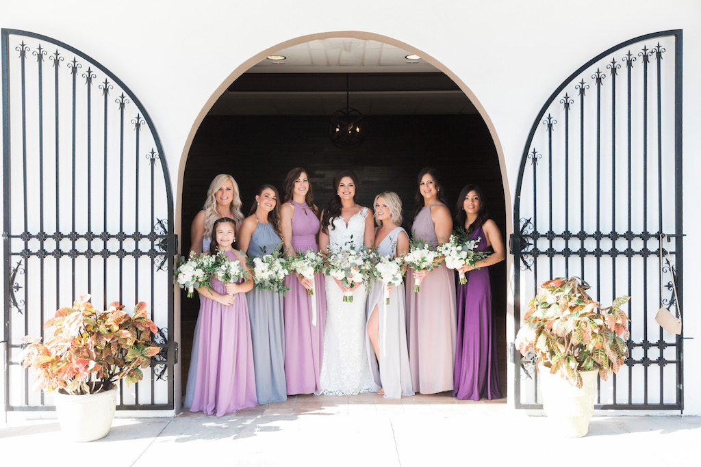 Florida Bride and Bridesmaids Wedding Portrait, Bridesmaids in Mismatched Lavender, Purple, Lilac and Grey Long Dresses with Organic Ivory and Greenery Floral Bouquets | St. Pete Beach Wedding Venue Hotel Zamora