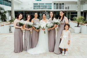 Tampa Bay Bride and Bridesmaids Wedding Portrait, Bridesmaids in Portobello Purple-Gray Mix and Match Long David's Bridal Dresses, Carrying Traditional White Baby's Breath Floral Bouquets, Flower Girl in Champagne Lace Dress | Florida Boutique Hotel and Wedding Venue The Hotel Alba in Westshore