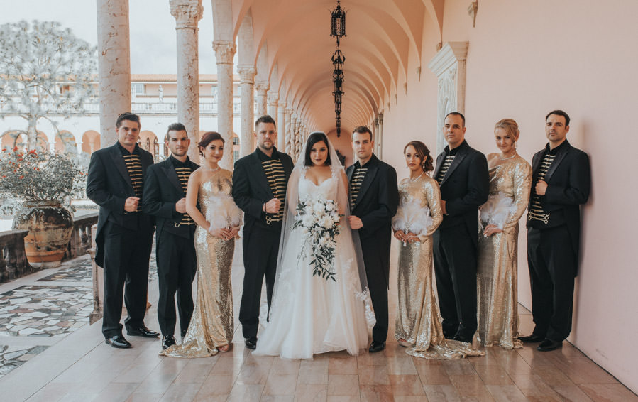 Glamorous, Circus Inspired Wedding, Sarasota Bride and Groom, Bridesmaids in Long Gold Sequined Dresses, Carrying White Feathered Bouquet, Bride in Isabella Talya Wedding Dress with White and Green Floral Bouquet | Historic Wedding Venue The Ringling