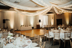 Traditional, Classic, Elegant Wedding Reception Decor, Lighted Draping, Round Tables with White Tablecloths, Gold Chiavari Chairs | Tampa Bay Boutique Hotel and Wedding Venue The Hotel Alba in Westshore | Gabro Event Services | Rentals A Chair Affair