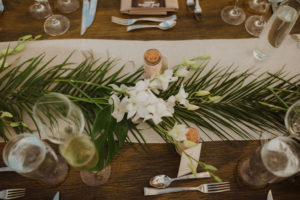 Tropical Wedding Decor, Wooden Table with Natural Element Centerpieces, Burlap Runner, Green Palm Leafs, White Orchids, Wine Cork Place Cards.