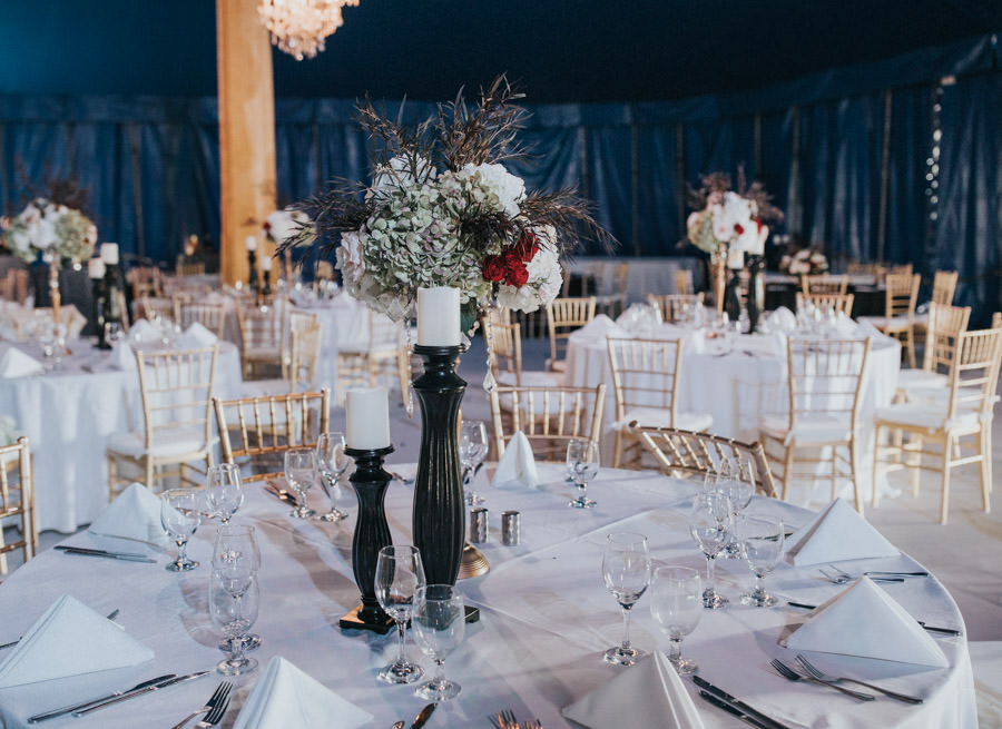 Unique, Modern Circus Inspired Tall Floral Centerpiece, White Hydrangeas, Red Roses, Greenery, Black Pillars with White Candles,