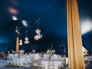 Glamorous, Modern Circus Inspired Wedding Reception, Under The Big Top, Suspended Chandelier Lighting, Gold Chiavari Chairs, Gold Drapping, Tall Floral Centerpieces | Venue Circus Sarasota under the Big Top at UTC
