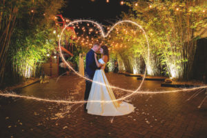 Florida Bride and Groom Romantic Nighttime Sparkler Heart Wedding Portrait in Bamboo Garden Courtyard | Downtown St. Pete Venue NOVA 535