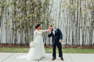 Classic, Elegant Florida Bride and Groom, Carrying Traditional Round White Floral Bouquet, Bamboo Wall | Tampa Bay Boutique Hotel and Wedding Venue The Hotel Alba in Westshore