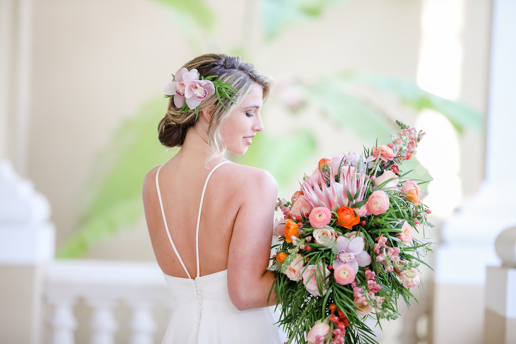 Boho Bride, Carrying Tropical Inspired, Garden Crescent Style Wedding Bouquet with Pink King Protea, Peach, White and Orange Florals with Greenery| Tampa Bay Wedding Photographer Lifelong Photography Studios | Truly Forever Bridal Shop Sarasota