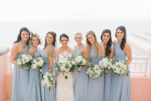 Tampa Bay Bride and Bridesmaids Wedding Portrait, Bridesmaids in Dusty Blue Cross Halter Top Long Dresses with White and Greenery Floral Bouquets by Bruce Wayne Florals | Waterfront Hotel Wedding Venue Hyatt Regency Clearwater Beach
