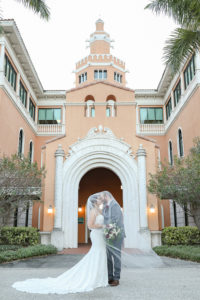 Outdoor Florida Bride and Groom Creative Wedding Portrait Under Wedding Veil | Tampa Wedding Photographer Lifelong Photography Studios | Tampa Bay Wedding Portraits | Stetson University College of Law