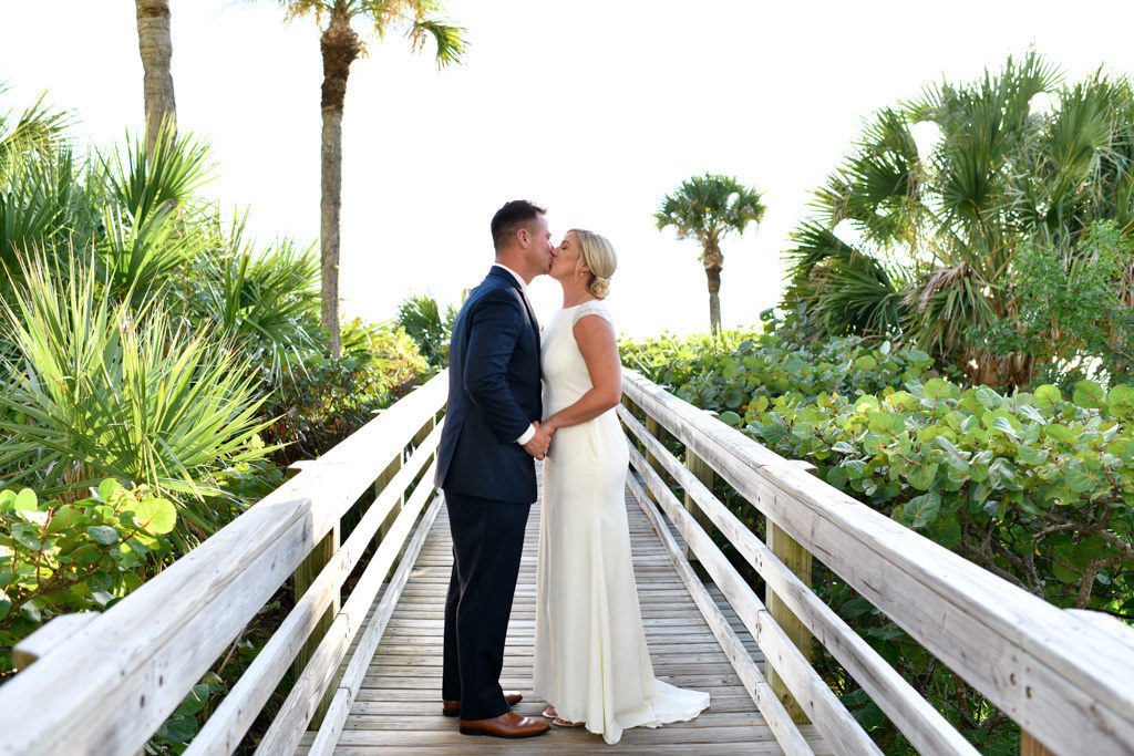 Sarasota Bride and Groom Kissing Wedding Portrait on Dock