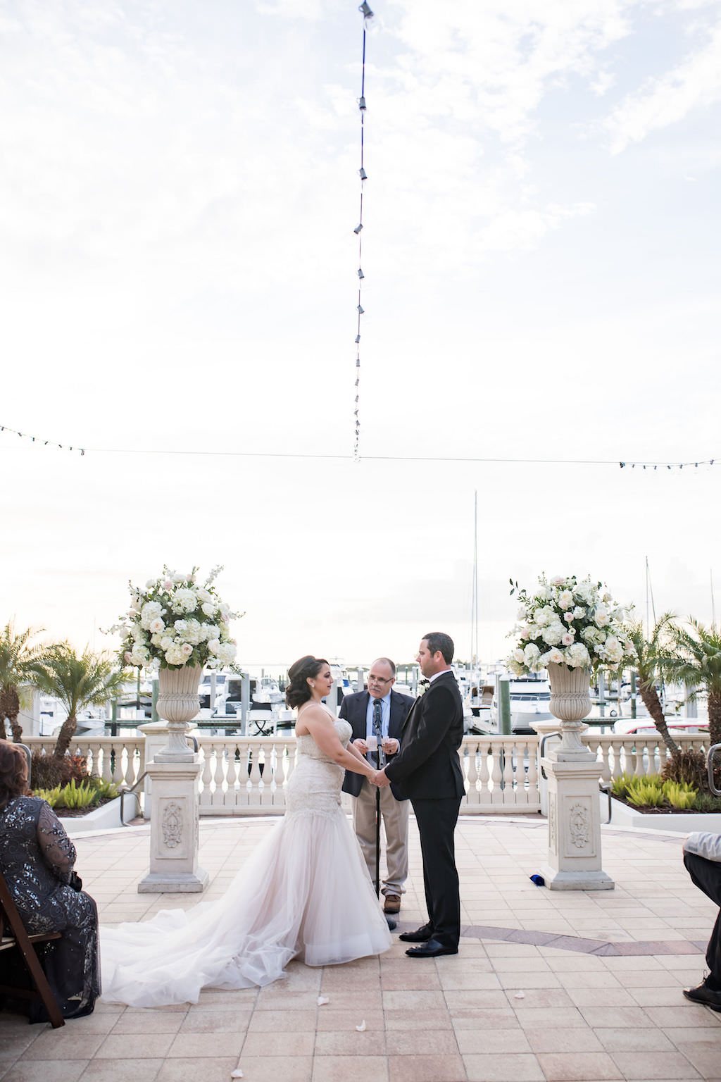Florida Bride and Groom Exchanging Vows During Wedding Ceremony Portrait | Waterfront Tampa Bay Wedding Venue Westshore Yacht Club