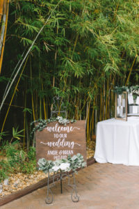 Romantic, Modern, Rustic Green and White Wedding Decor, Florida Outdoor Ceremony Wooden Welcome Sign with Calligraphy, in Bamboo Courtyard | Downtown St. Pete Venue NOVA 535 | Florida Wedding Photographer Kera Photography