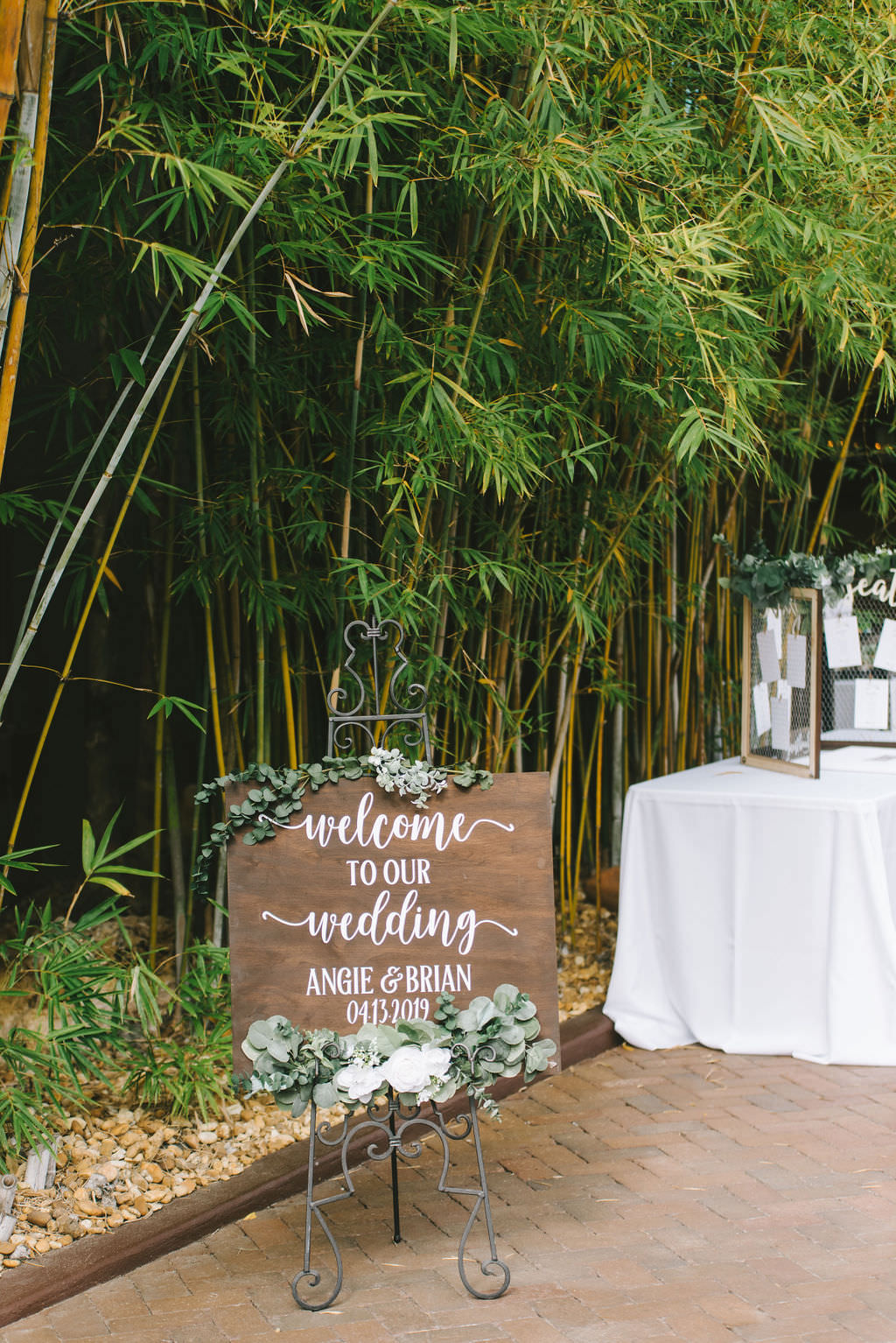 Romantic, Modern, Rustic Green and White Wedding Decor, Florida Outdoor Ceremony Wooden Welcome Sign with Calligraphy, in Bamboo Courtyard | Downtown St. Pete Venue NOVA 535 | Florida Wedding Photographer Kera Photography