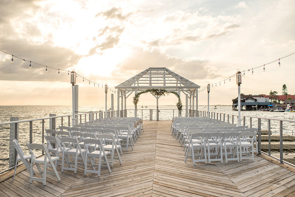 Sunset Waterfront Dockside Wedding Ceremony Under Cabana, Nautical Inspired Decor, Green Floral Arch | | Tampa Bay Hotel and Wedding Venue The Godfrey Hotel & Cabanas