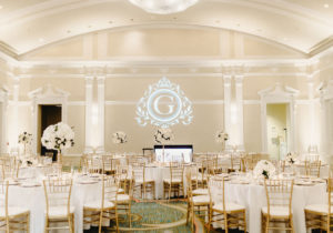 Classic Traditional Ballroom Wedding Reception Decor, Round Tables with Tall White Floral Centerpieces and Gold Chiavari Chairs, Custom Monogram Gobo Logo Projection | Downtown St. Pete Hotel Wedding Venue The Vinoy Renaissance