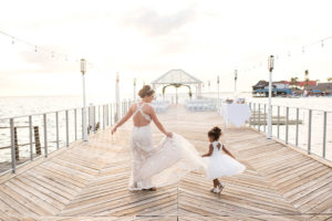 Tampa Bay Bride and Flower Girl Twirl at Waterfront Dockside Wedding Sunset Ceremony Portrait| | Florida Hotel and Wedding Venue The Godfrey Hotel & Cabanas
