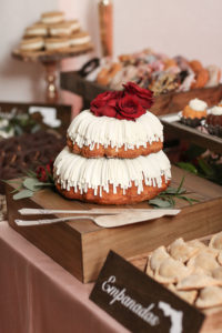 Two Tier Rustic Elegant White Frosted Bundt Cake with Real Red Roses Cake Topper on Desert Sweets Table | Tampa Wedding Photographer Lifelong Photography Studios | Tampa Wedding Planner Breezin' Weddings