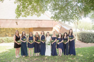 Florida Bride and Bridesmaids in Navy Blue Mismatched Dresses Holding Tropical Floral Bouquets | Tampa Bay Wedding Photographer Kristen Marie Photography | Tampa Bay Wedding Planner Special Moments Event Planning | Tampa Bay Wedding Hair and Makeup Femme Akoi
