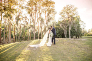 Florida Bride and Groom Sunset Golf Course Wedding Portrait, Long Cathedral Veil | Tampa Bay Wedding Photographer Kristen Marie Photography | Innisbrook Golf & Spa Resort Wedding Venue