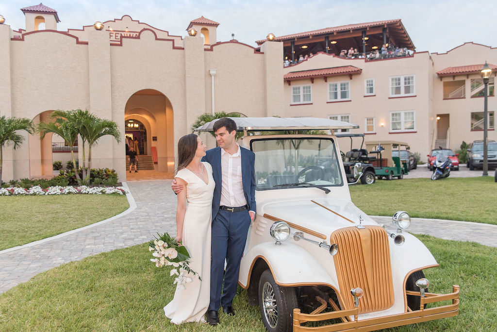 Florida Bride and Groom Classic Wedding Portrait in Front of Vintage Classic Car Outside Dunedin Wedding Venue Fenway Hotel | Tampa Bay Wedding Photographer Kristen Marie Photography