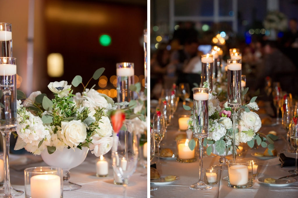Elegant, Romantic Ballroom Wedding Reception with Long Feasting Tables, Low White Centerpieces, and Candles