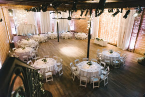 Modern, Elegant White and Green Wedding reception Decor, Round Tables, String Lighting and Red Brick Backdrop | Unique Downtown St. Pete Venue NOVA 535 | Florida Photographer Kera Photography