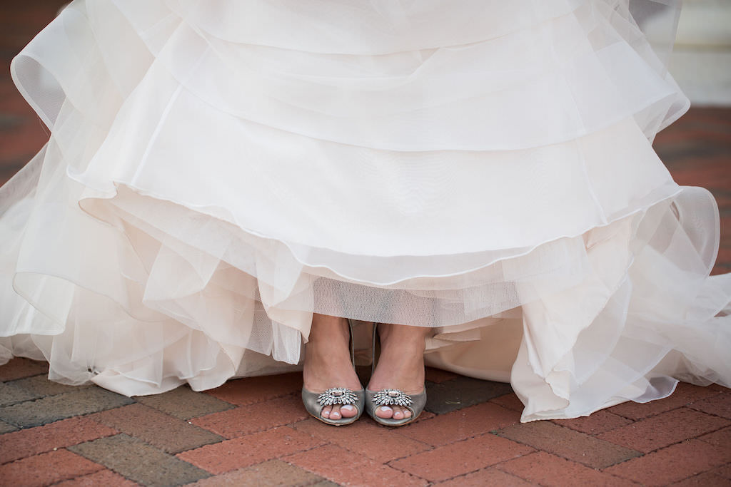 Tampa Bay Bride Showing Off Silver Peep Toe with Rhinestone Brooch Accessory Wedding Shoes and Textured Tulle Wedding Dress Skirt