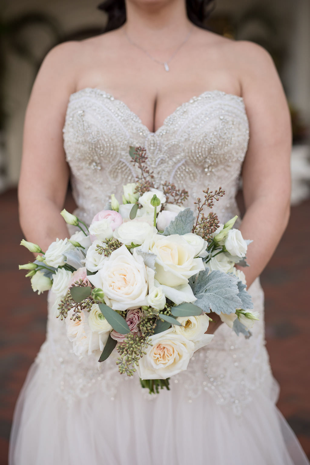 Tampa Bay Bride Holding Organic Ivory, Blush Pink Rose Florals and Dusty Miller Greenery Bouquet