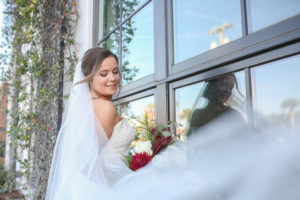 Florida Bride Creative Wedding Portrait with Cathedral Length Veil Blowing in Wind | Tampa Bay Wedding Photographer Lifelong Photography Studios | Tampa Bay Wedding Hair and Makeup Team Renee Michele the Studio