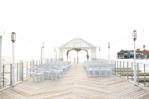 Waterfront Dockside Wedding Ceremony Under Cabana, Nautical Inspired Decor, Green Floral Arch | | Tampa Bay Hotel and Wedding Venue The Godfrey Hotel & Cabanas