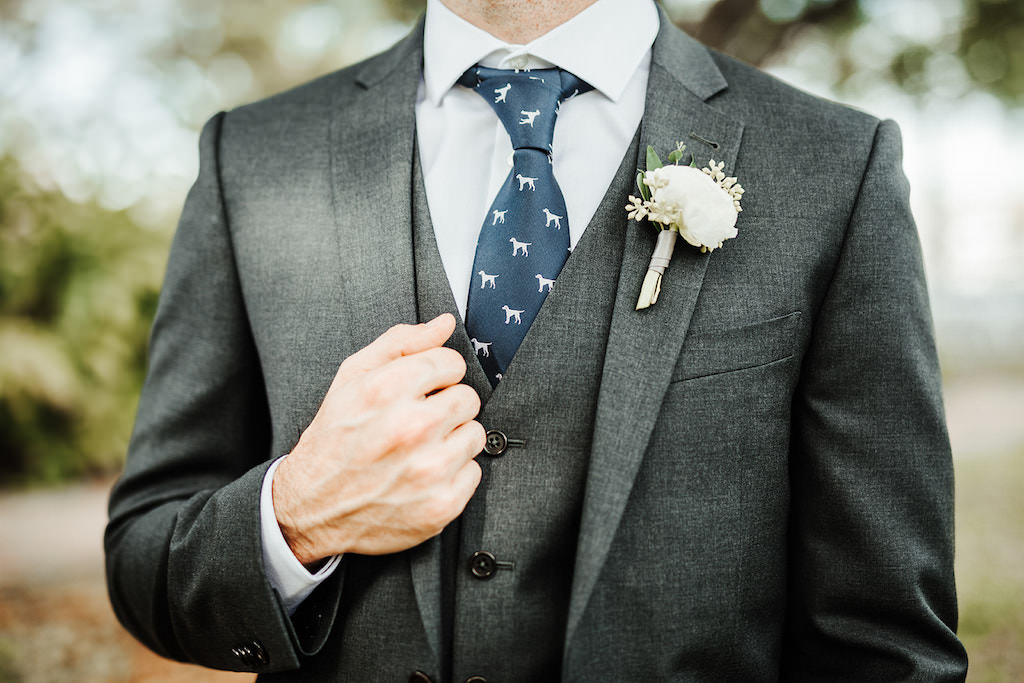 Florida Groom in Dark Grey Suit and Vest with Dog Print Navy Blue Tie and White Floral Boutonniere Wedding Portrait