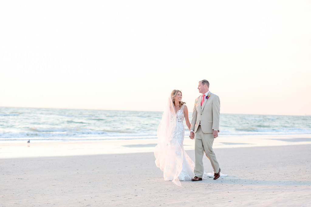 St. Pete Beach Bride and Groom Stroll on Sand | | Florida Beach Wedding Venue Hotel Zamora | Tampa Bay Wedding Photographer Lifelong Photography Studios